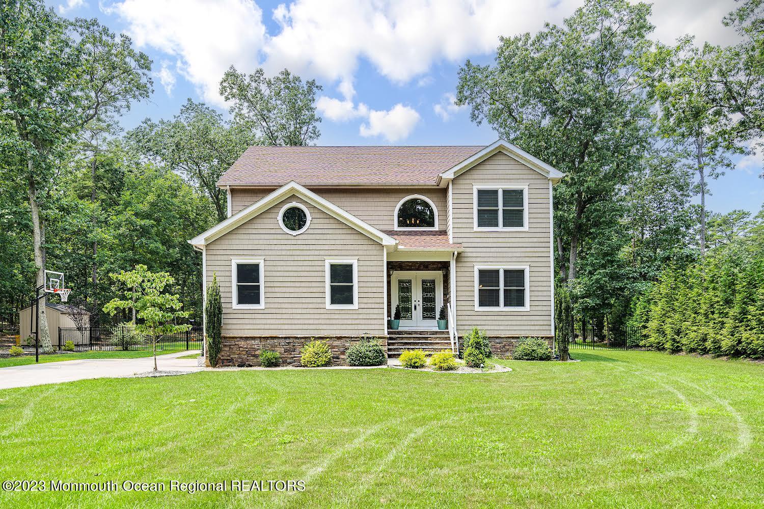 108 Wiseman Road Jackson, NJ 08527 - Photo 1 of 42 a front view of house with yard and green space