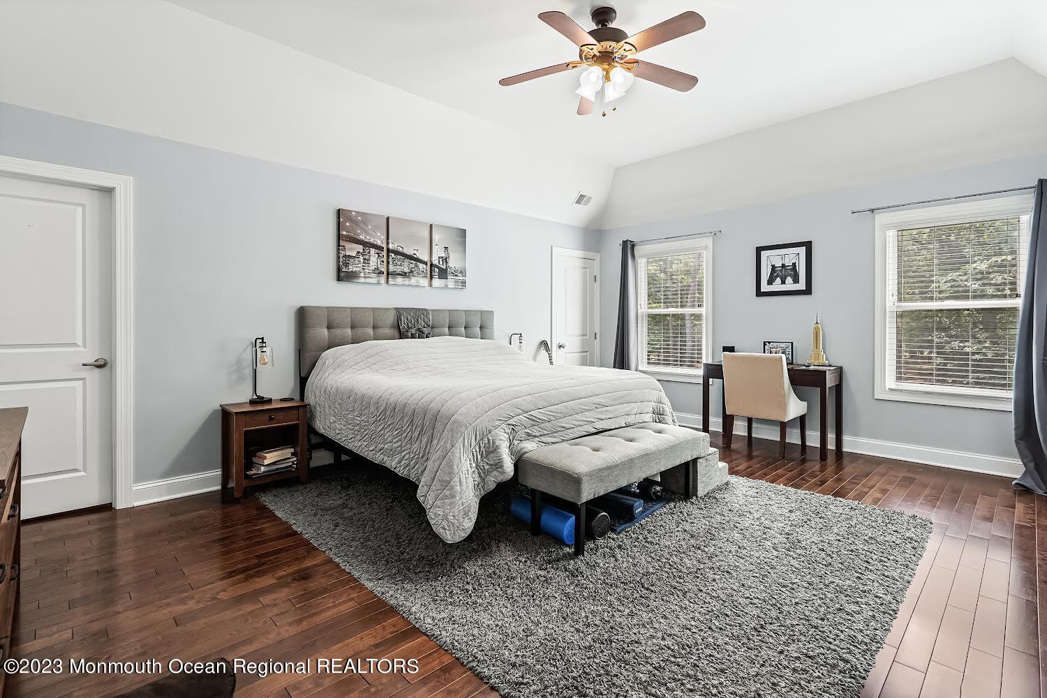 108 Wiseman Road Jackson, NJ 08527 - Photo 20 of 42 a bedroom with a bed and a table in it with wooden floor