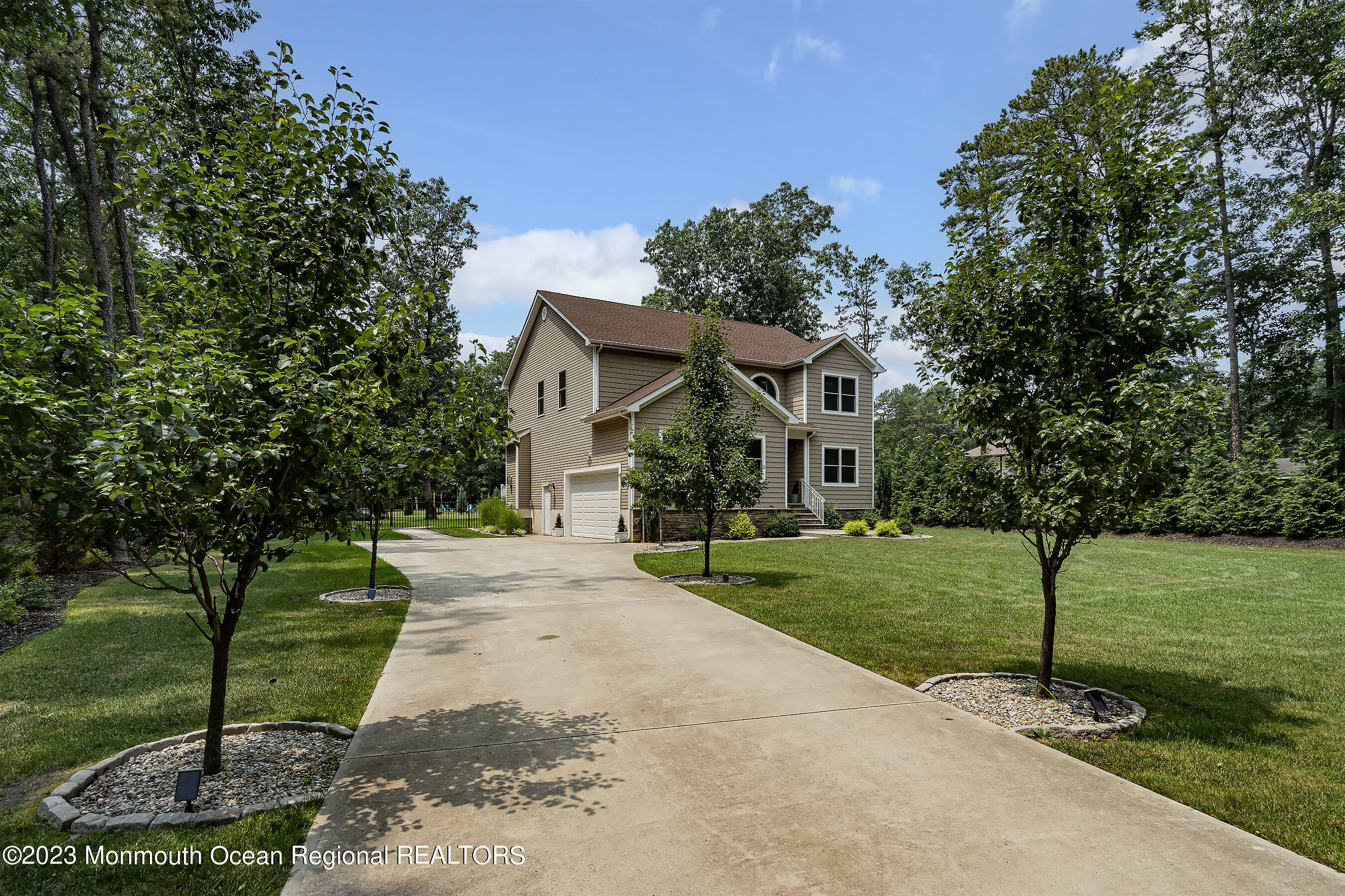 108 Wiseman Road Jackson, NJ 08527 - Photo 3 of 42 a front view of a house with a yard
