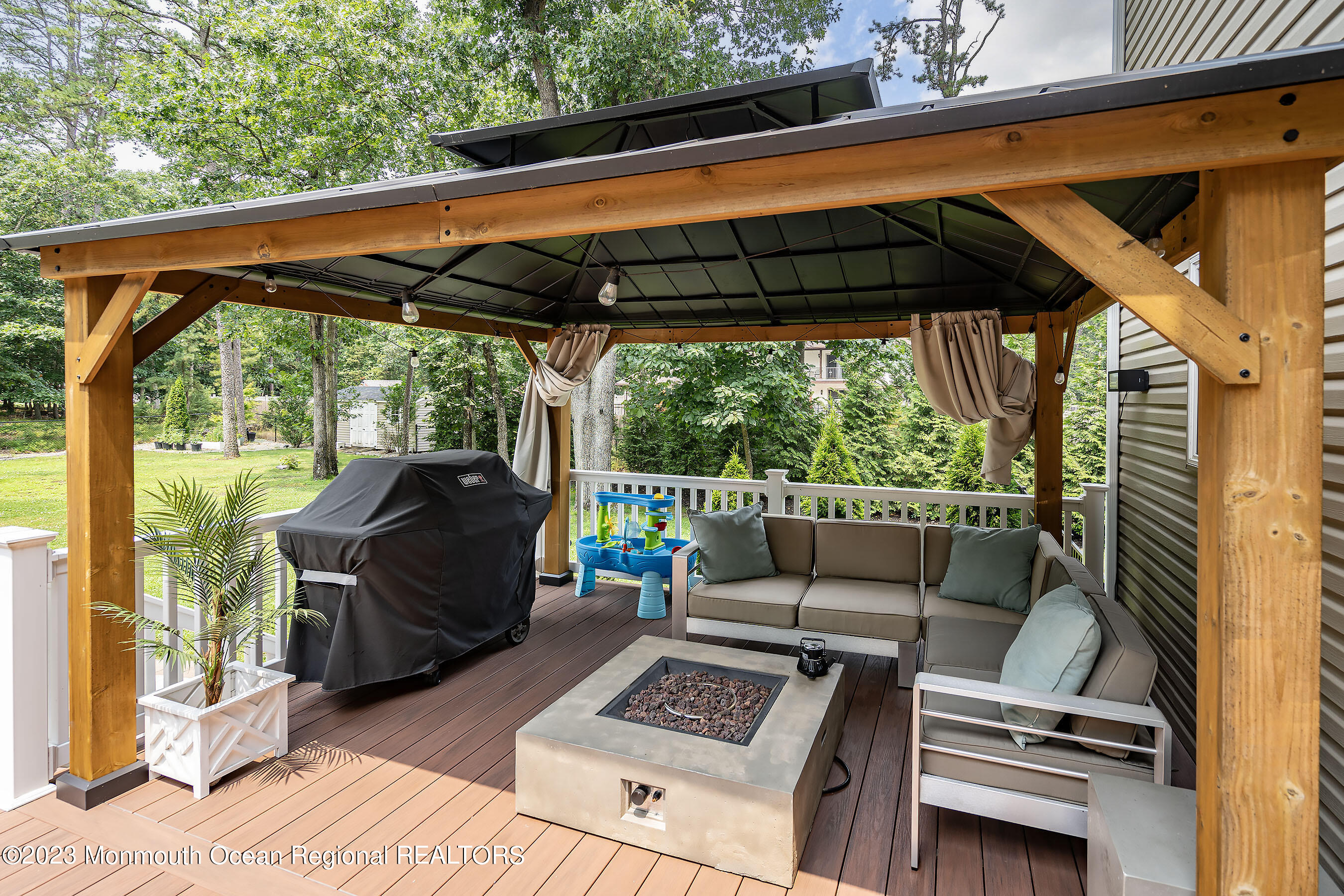 108 Wiseman Road Jackson, NJ 08527 - Photo 31 of 42 a backyard of a house with chairs and a table