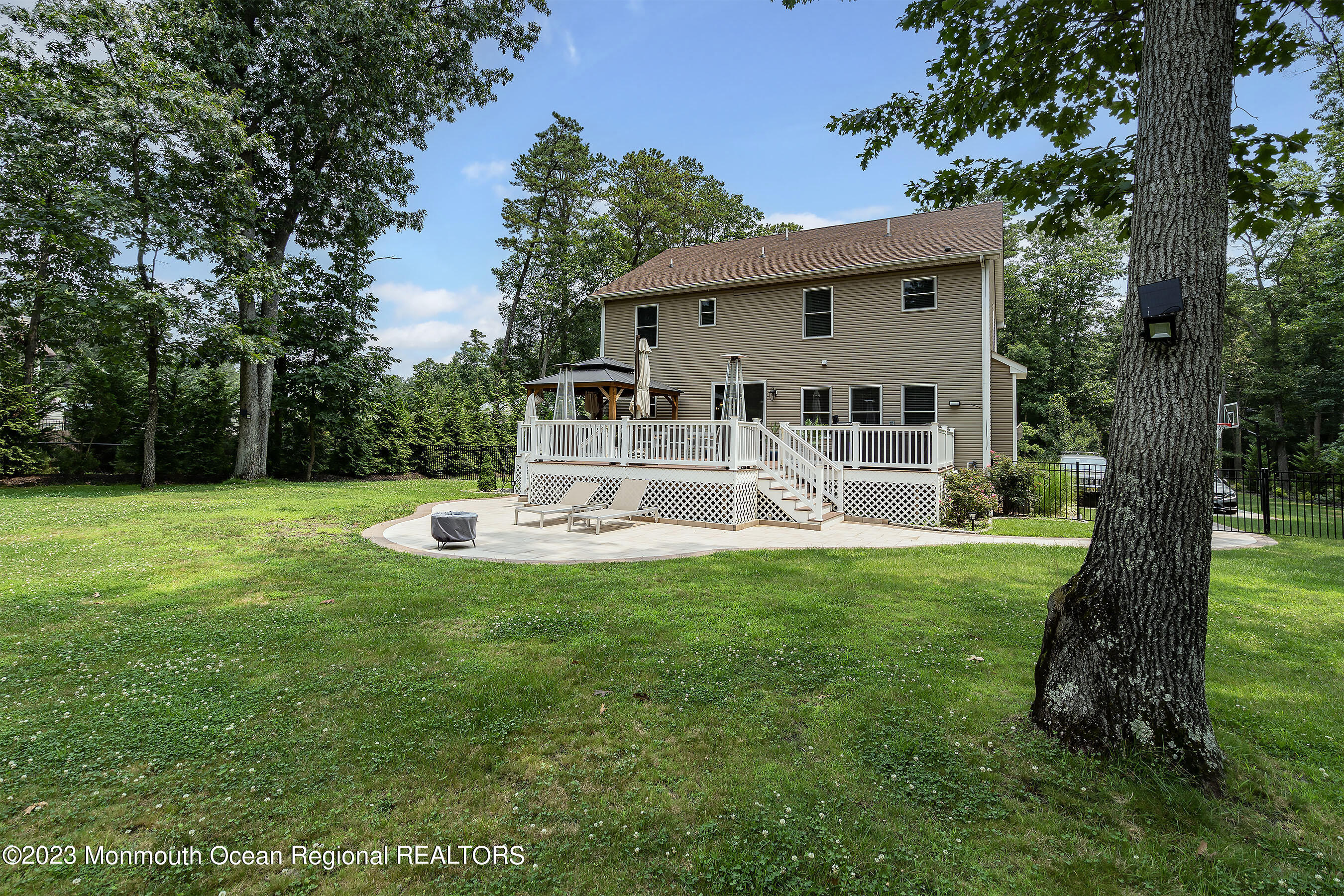 108 Wiseman Road Jackson, NJ 08527 - Photo 35 of 42 a front view of a house with garden and a garden