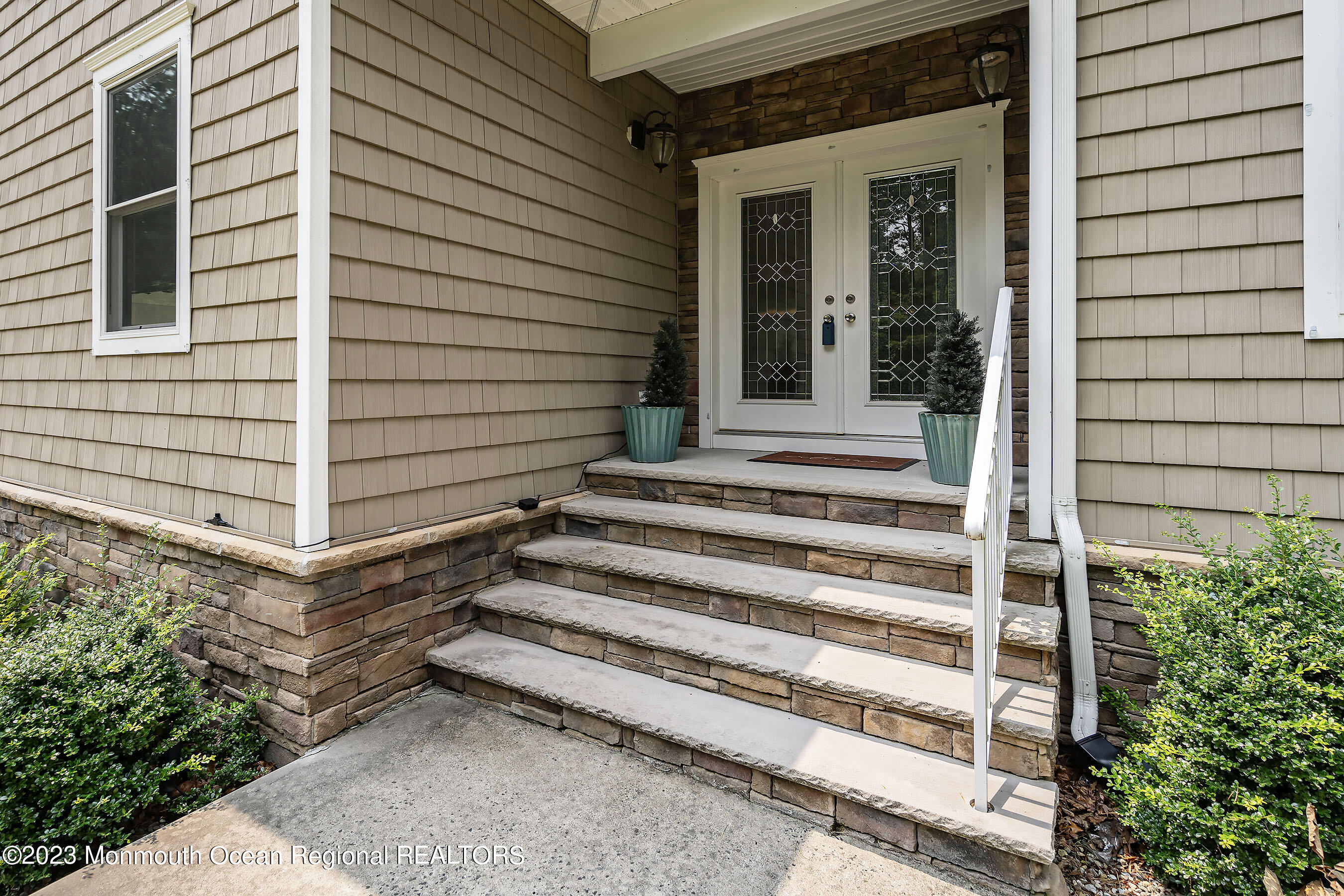 108 Wiseman Road Jackson, NJ 08527 - Photo 5 of 42 a view of a house with a large window and stairs