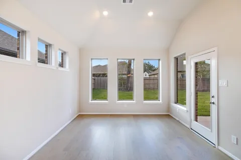 a spacious bathroom with a tub sink shower and mirror