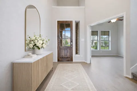 a large kitchen with kitchen island a sink stainless steel appliances and cabinets