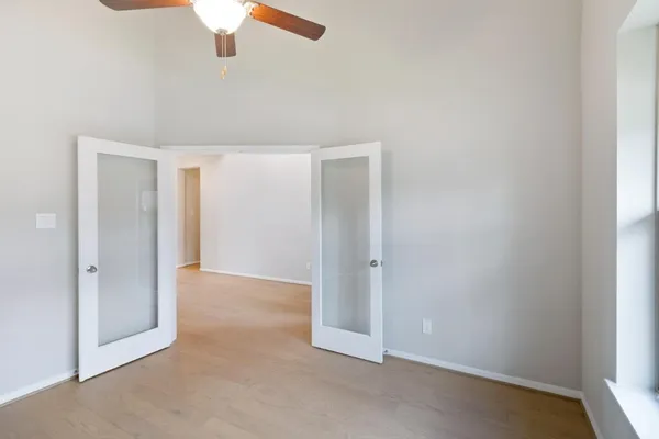 a view of an empty room with a window