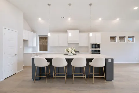 a view of a big room with closet and chandelier fan