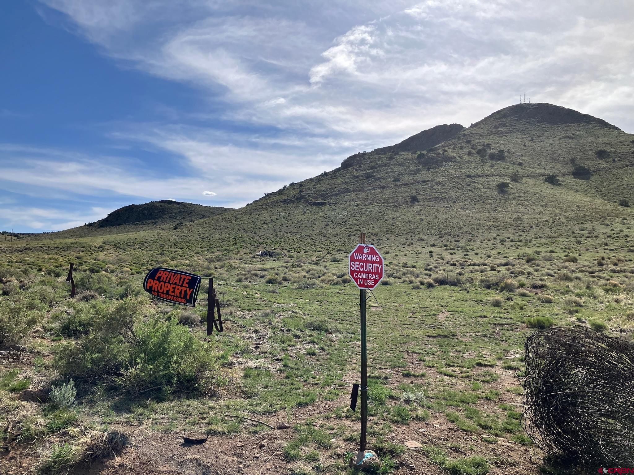 Tbd Tbd Spruce Street Del Norte, CO 81132 - Photo 19 of 44 a front view of a house with a forest