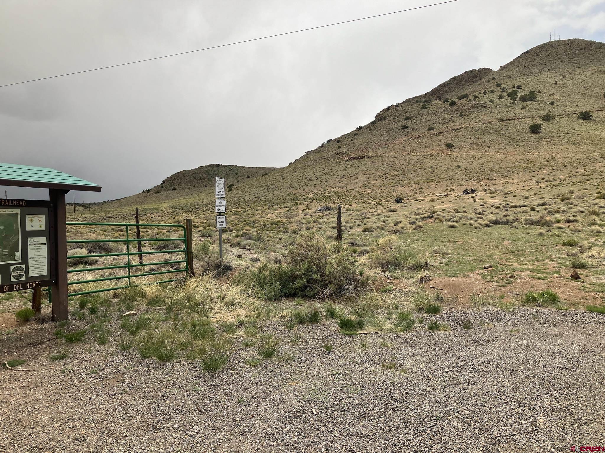 Tbd Tbd Spruce Street Del Norte, CO 81132 - Photo 7 of 44 a view of a dry yard with wooden fence