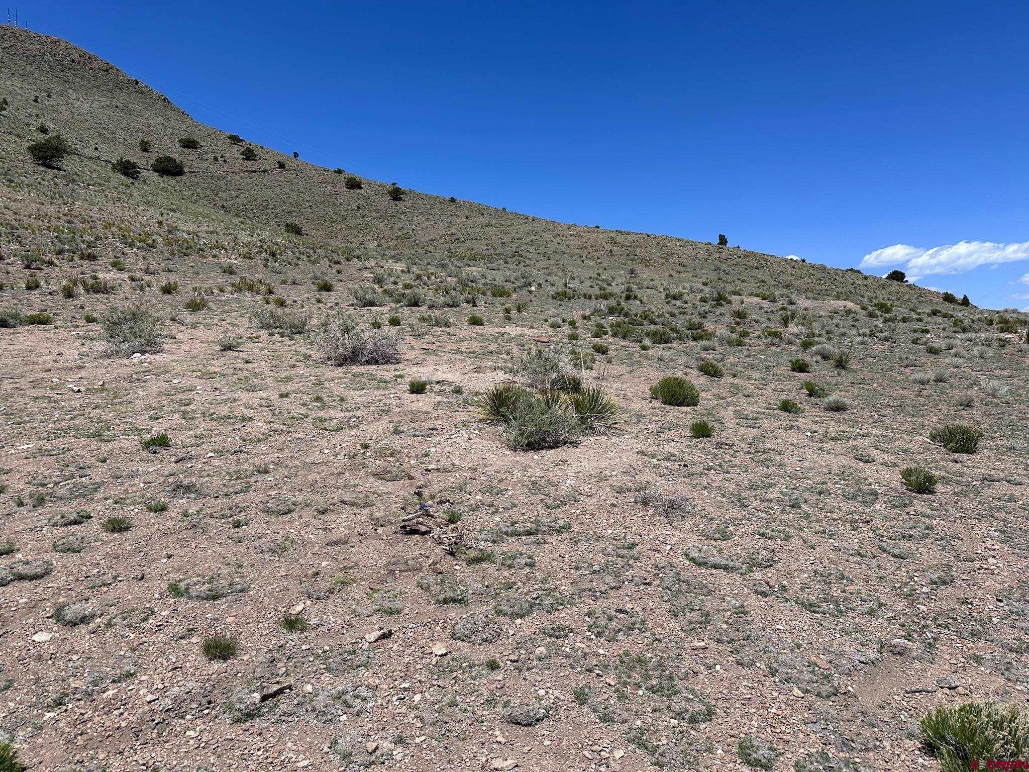 Tbd Tbd Spruce Street Del Norte, CO 81132 - Photo 9 of 44 a view of a beach with a mountain view