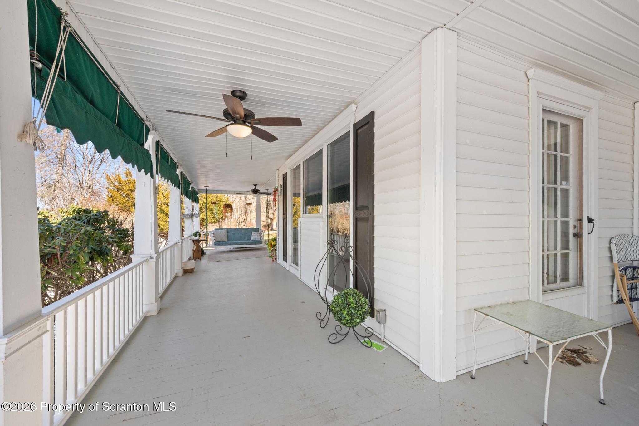 502 Gravel Pond Road Clarks Summit, PA 18411 - Photo 12 of 91 a view of a porch with furniture and garden