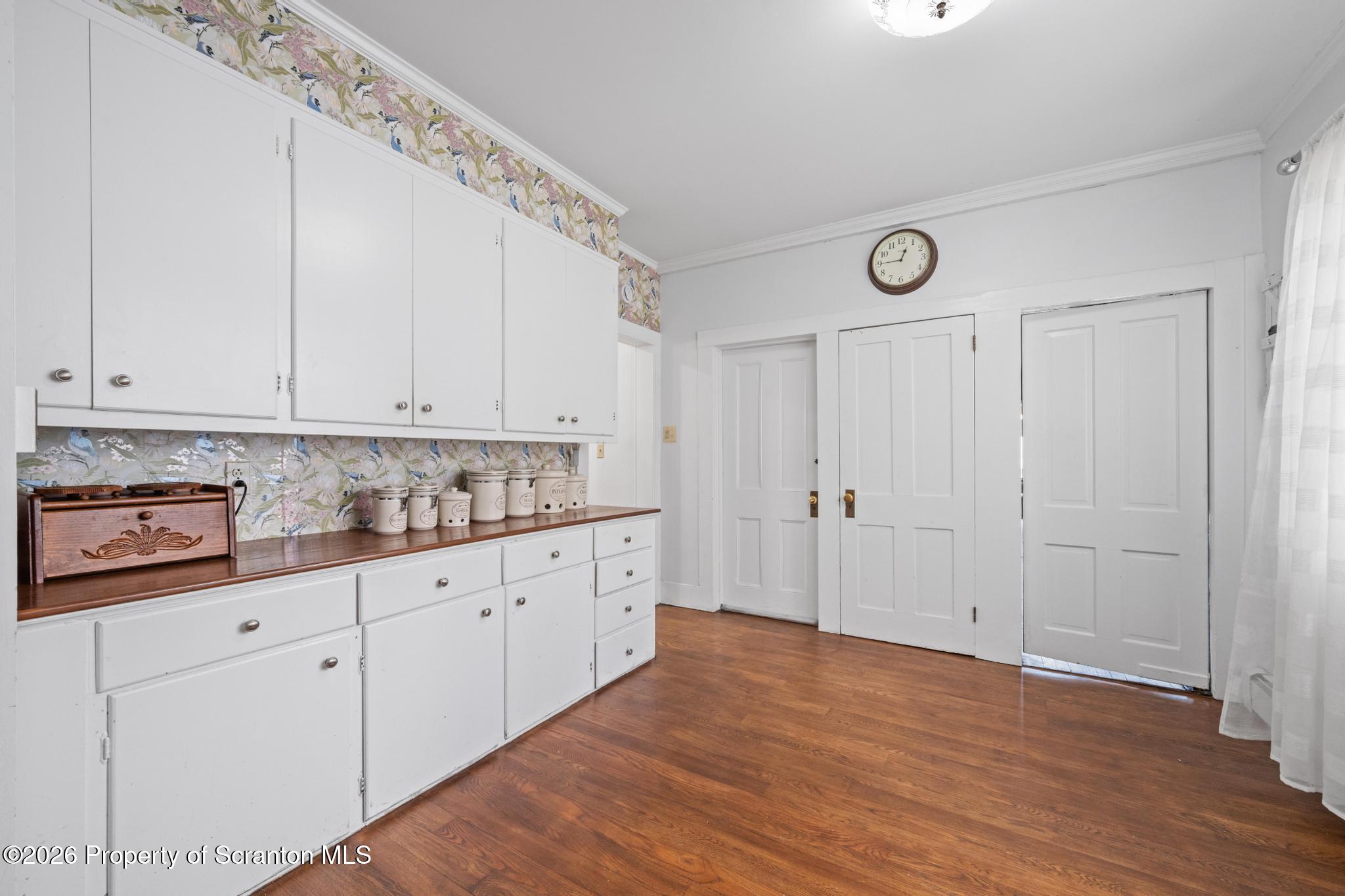 502 Gravel Pond Road Clarks Summit, PA 18411 - Photo 23 of 91 a kitchen with granite countertop white cabinets and white appliances