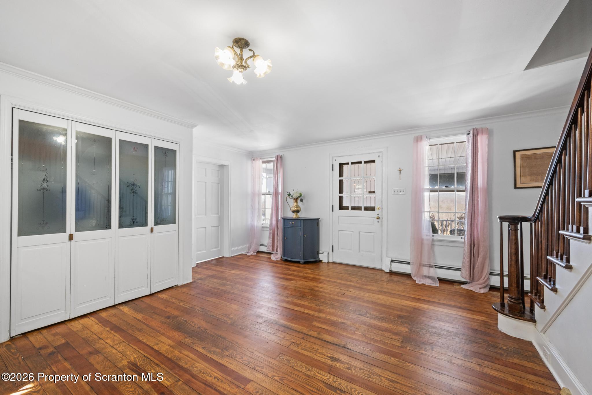502 Gravel Pond Road Clarks Summit, PA 18411 - Photo 28 of 91 a view of an empty room with a window and wooden floor