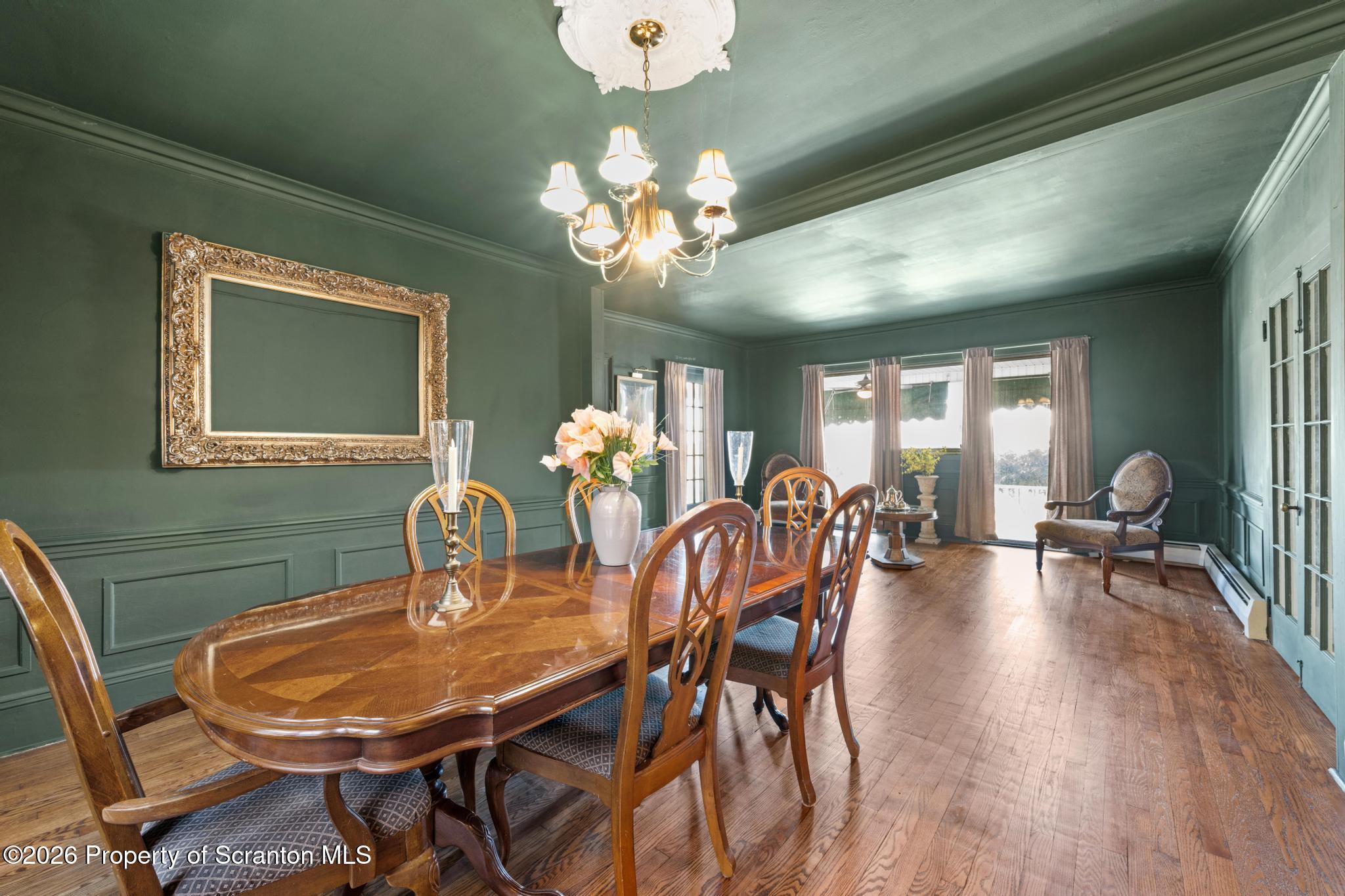 502 Gravel Pond Road Clarks Summit, PA 18411 - Photo 35 of 91 a view of a dining room with furniture and chandelier