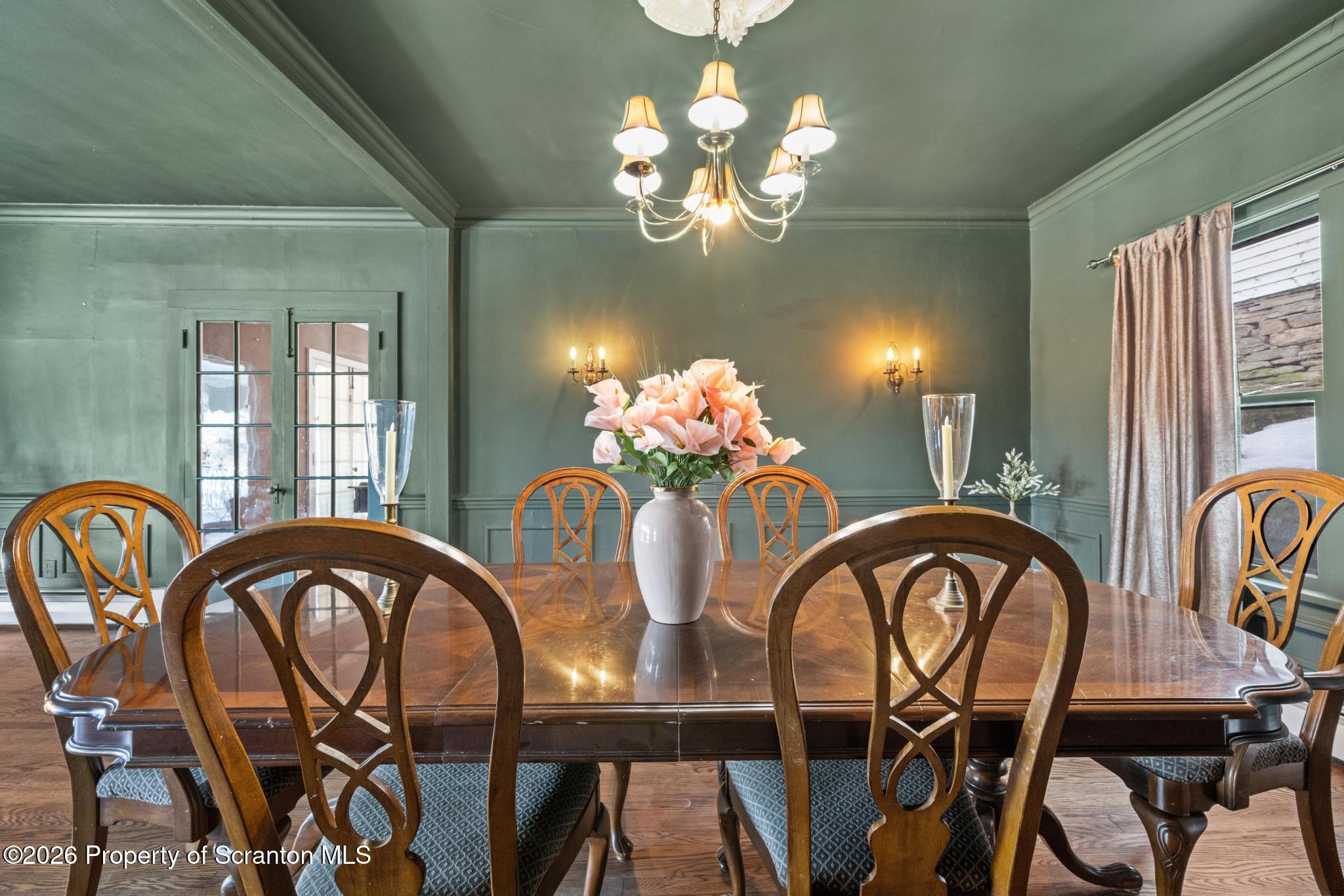 502 Gravel Pond Road Clarks Summit, PA 18411 - Photo 40 of 91 a view of a dining room with furniture chandelier and wooden floor