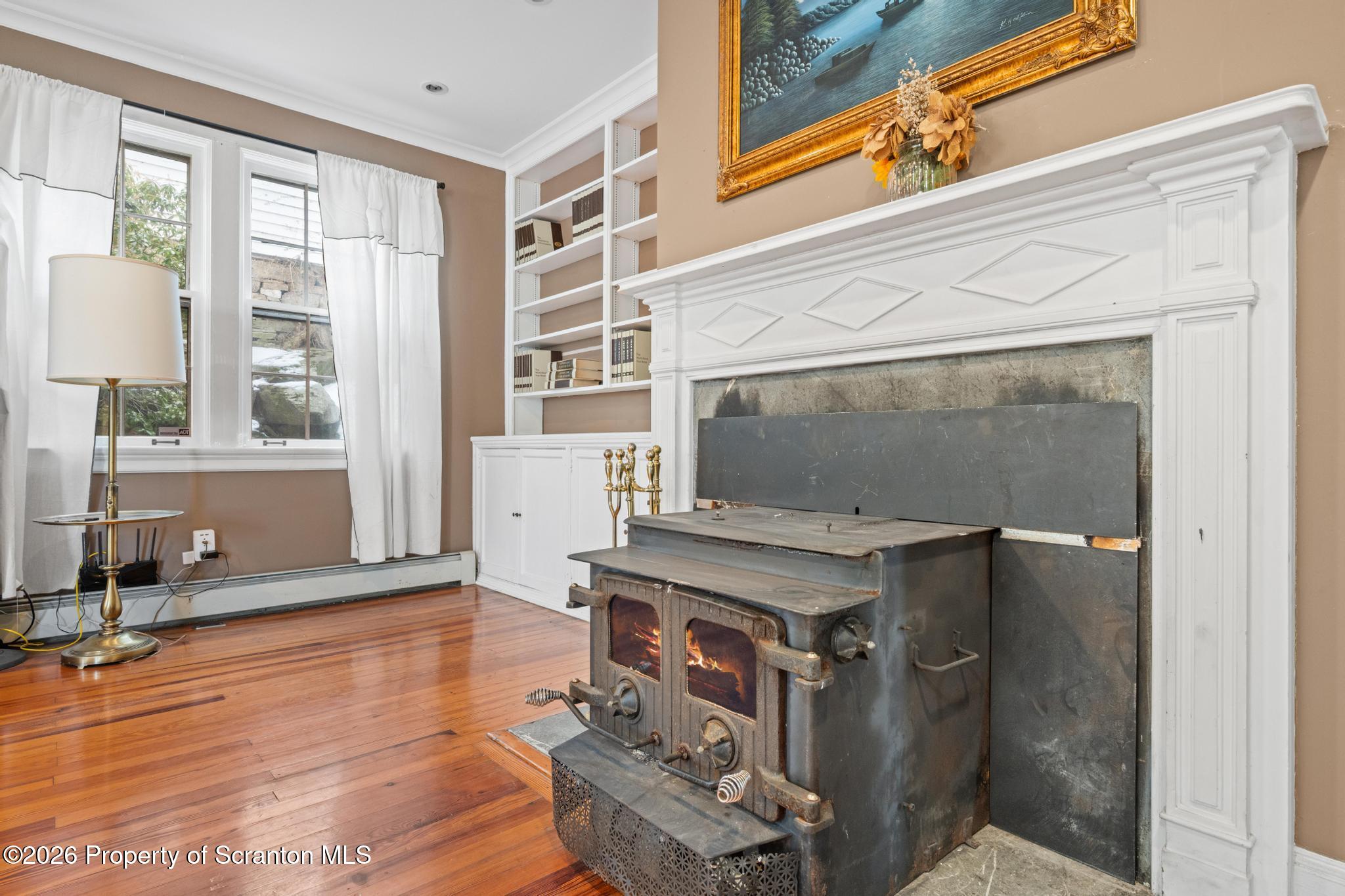 502 Gravel Pond Road Clarks Summit, PA 18411 - Photo 44 of 91 a living room with furniture and a fireplace