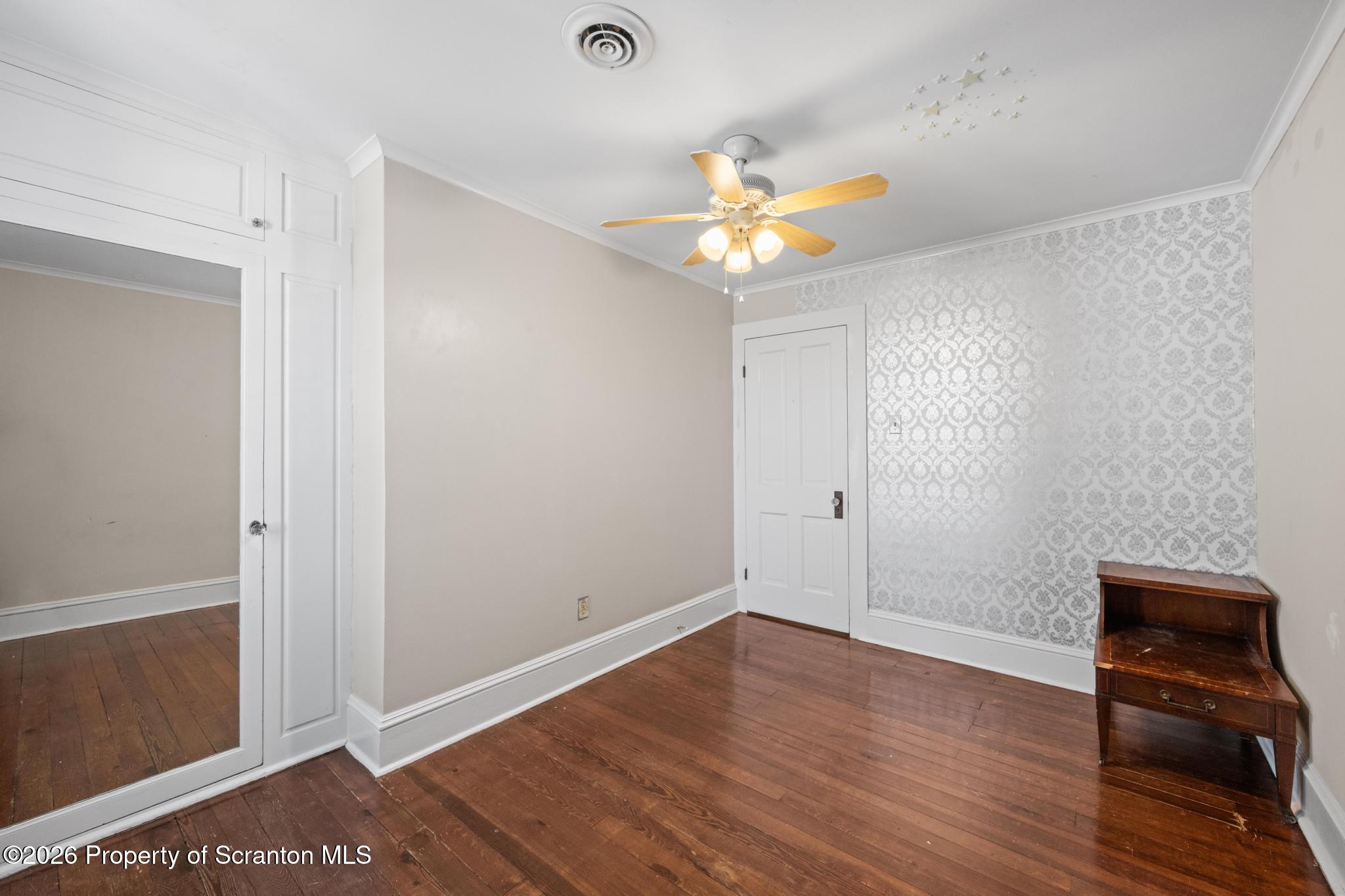 502 Gravel Pond Road Clarks Summit, PA 18411 - Photo 49 of 91 wooden floor in an empty room with a window