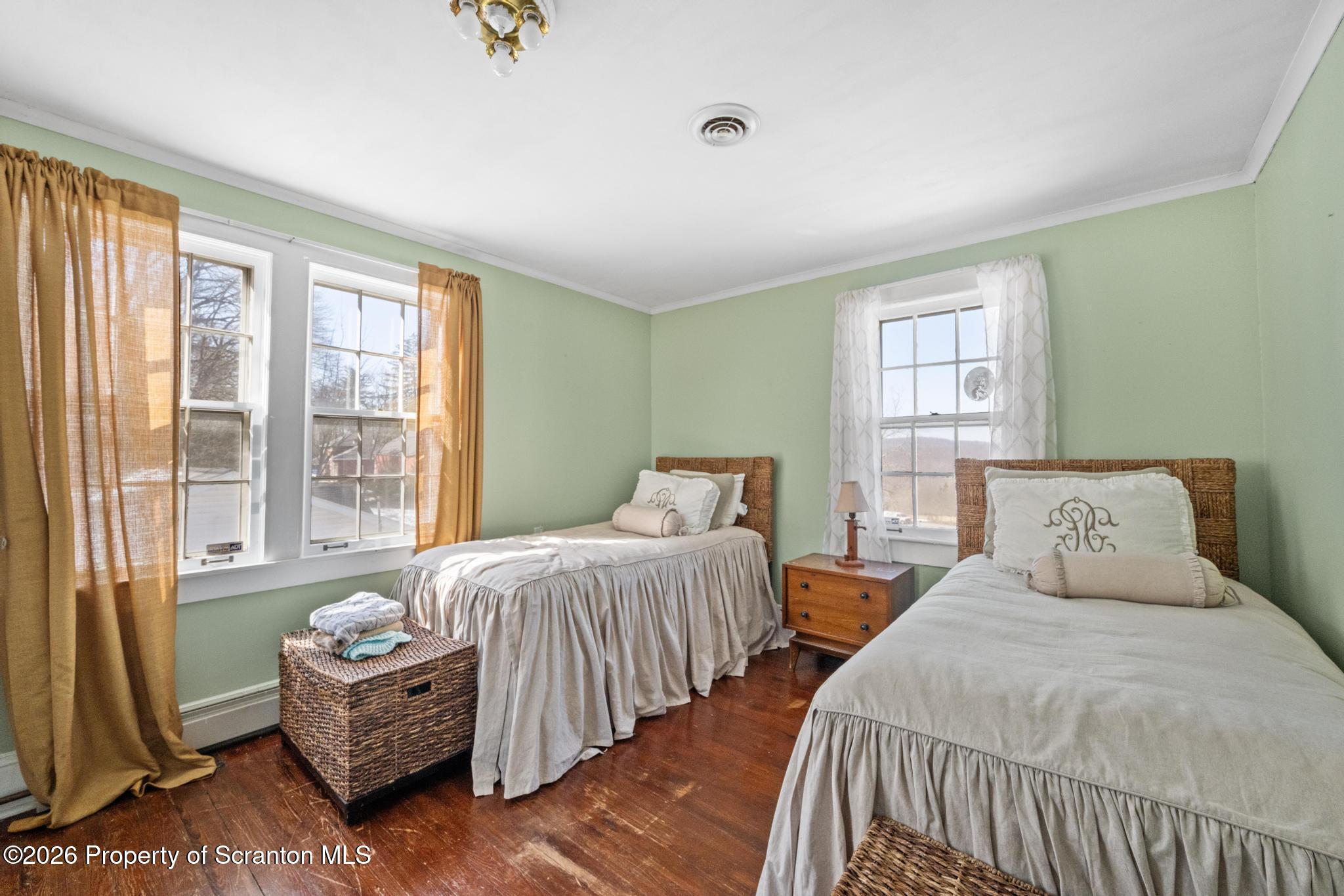 502 Gravel Pond Road Clarks Summit, PA 18411 - Photo 50 of 91 a bedroom with two beds and large window
