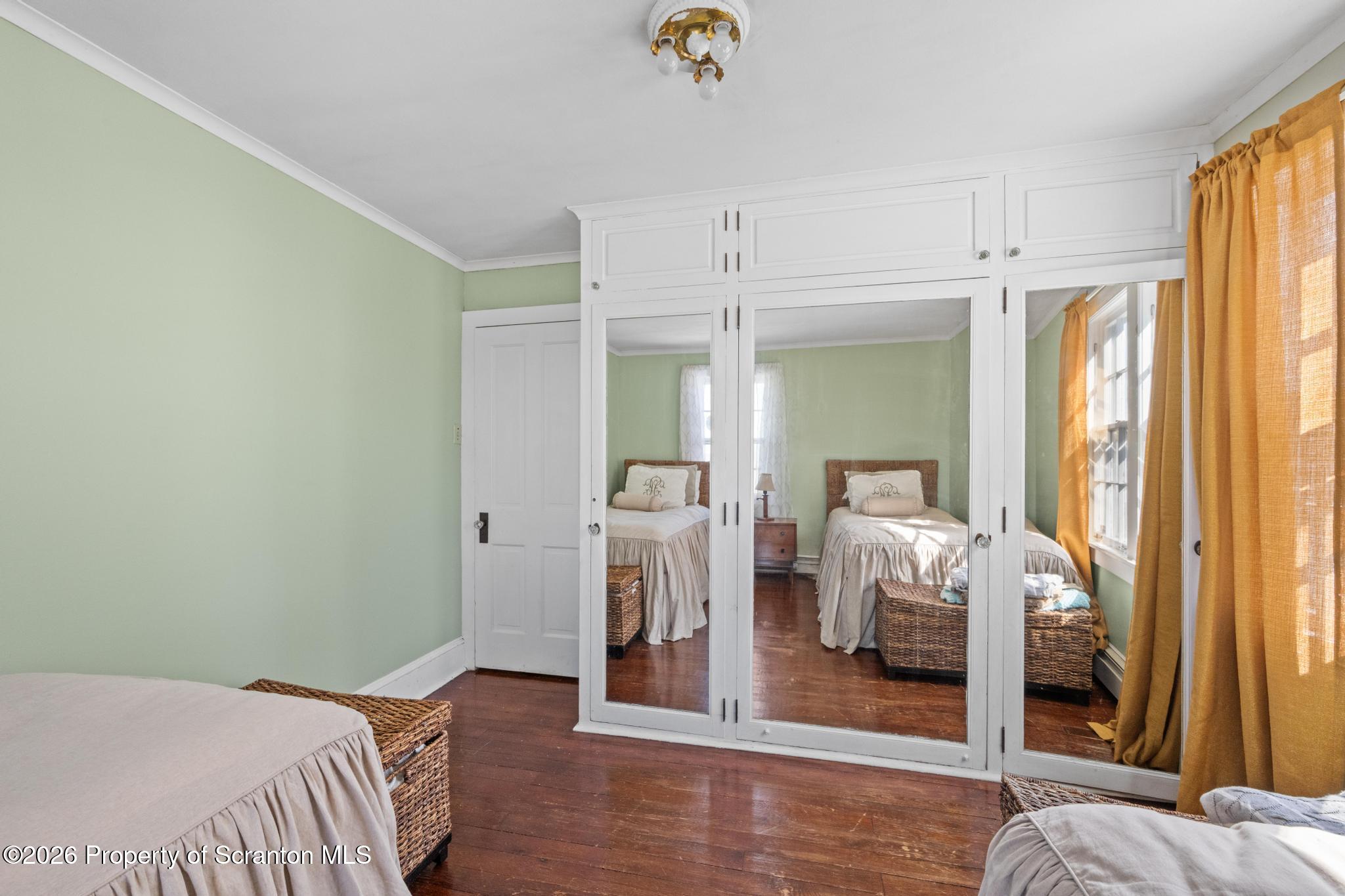 502 Gravel Pond Road Clarks Summit, PA 18411 - Photo 51 of 91 a bedroom with a bed and a mirror