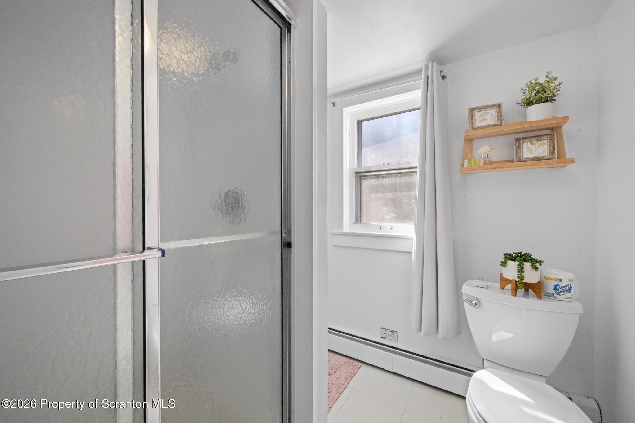 502 Gravel Pond Road Clarks Summit, PA 18411 - Photo 52 of 91 a white toilet sitting next to a bathroom sink
