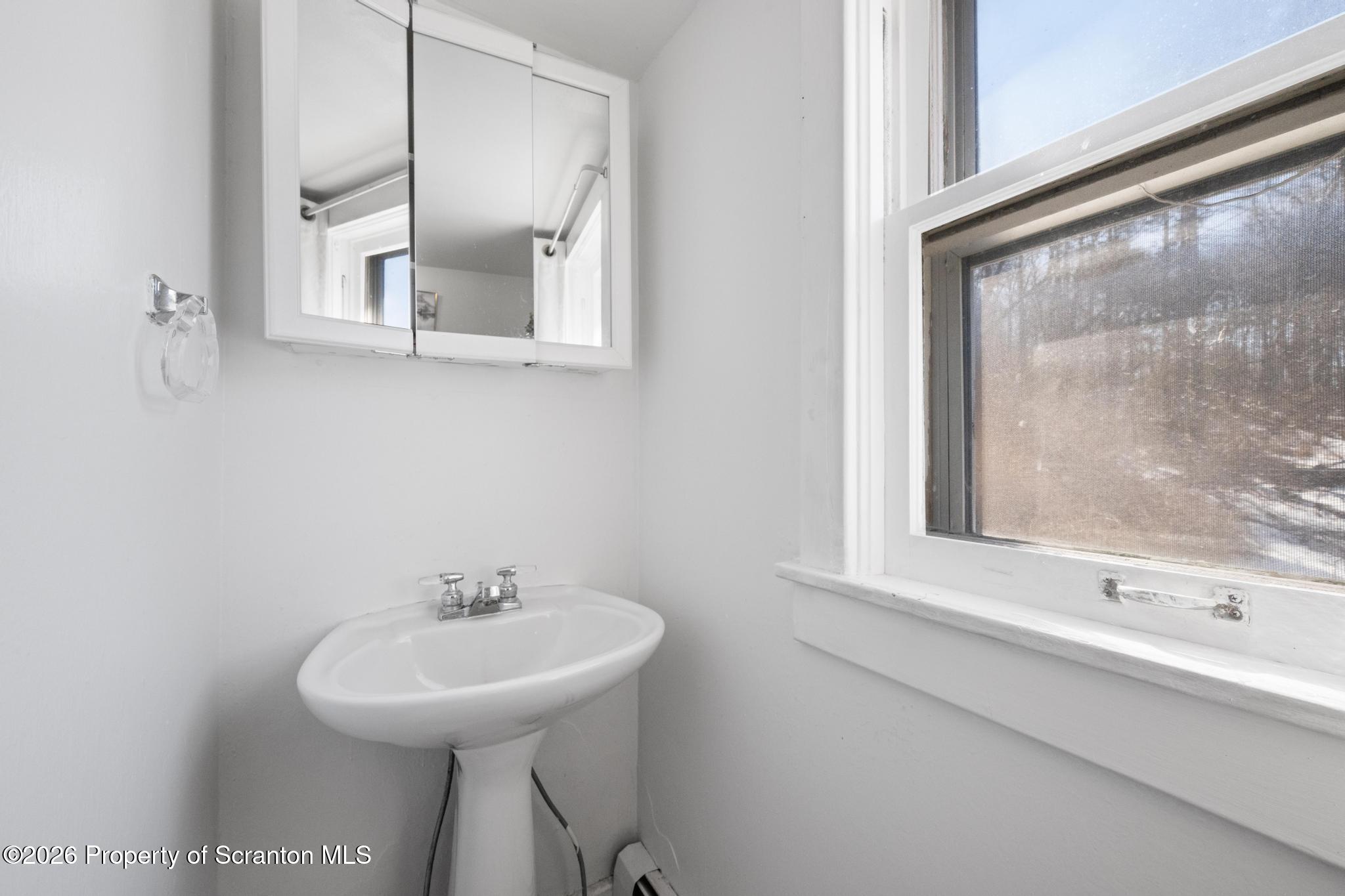 502 Gravel Pond Road Clarks Summit, PA 18411 - Photo 53 of 91 a bathroom with a sink and a mirror