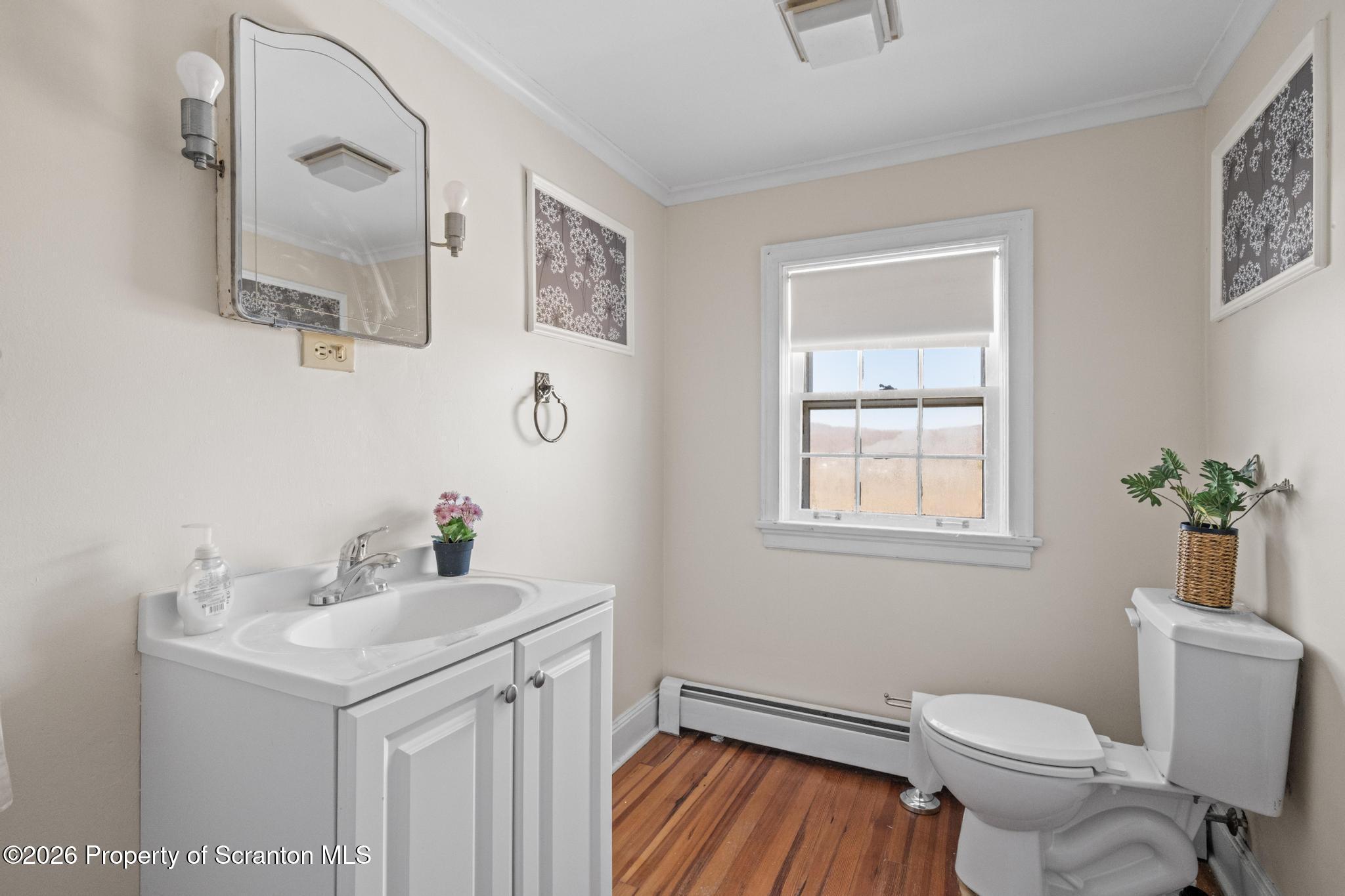 502 Gravel Pond Road Clarks Summit, PA 18411 - Photo 63 of 91 a bathroom with a sink toilet and mirror