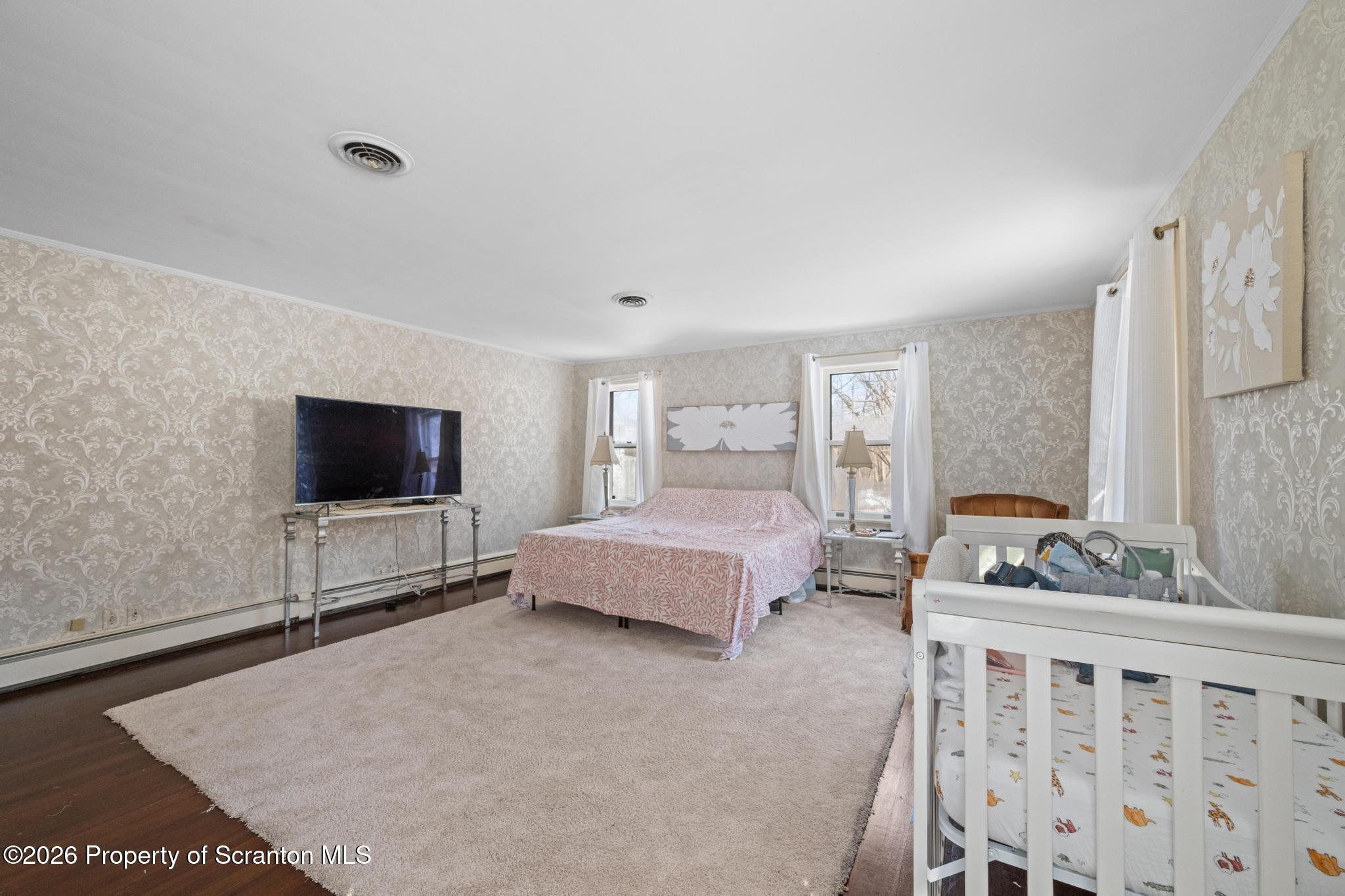 502 Gravel Pond Road Clarks Summit, PA 18411 - Photo 72 of 91 a bedroom with furniture and a flat screen tv