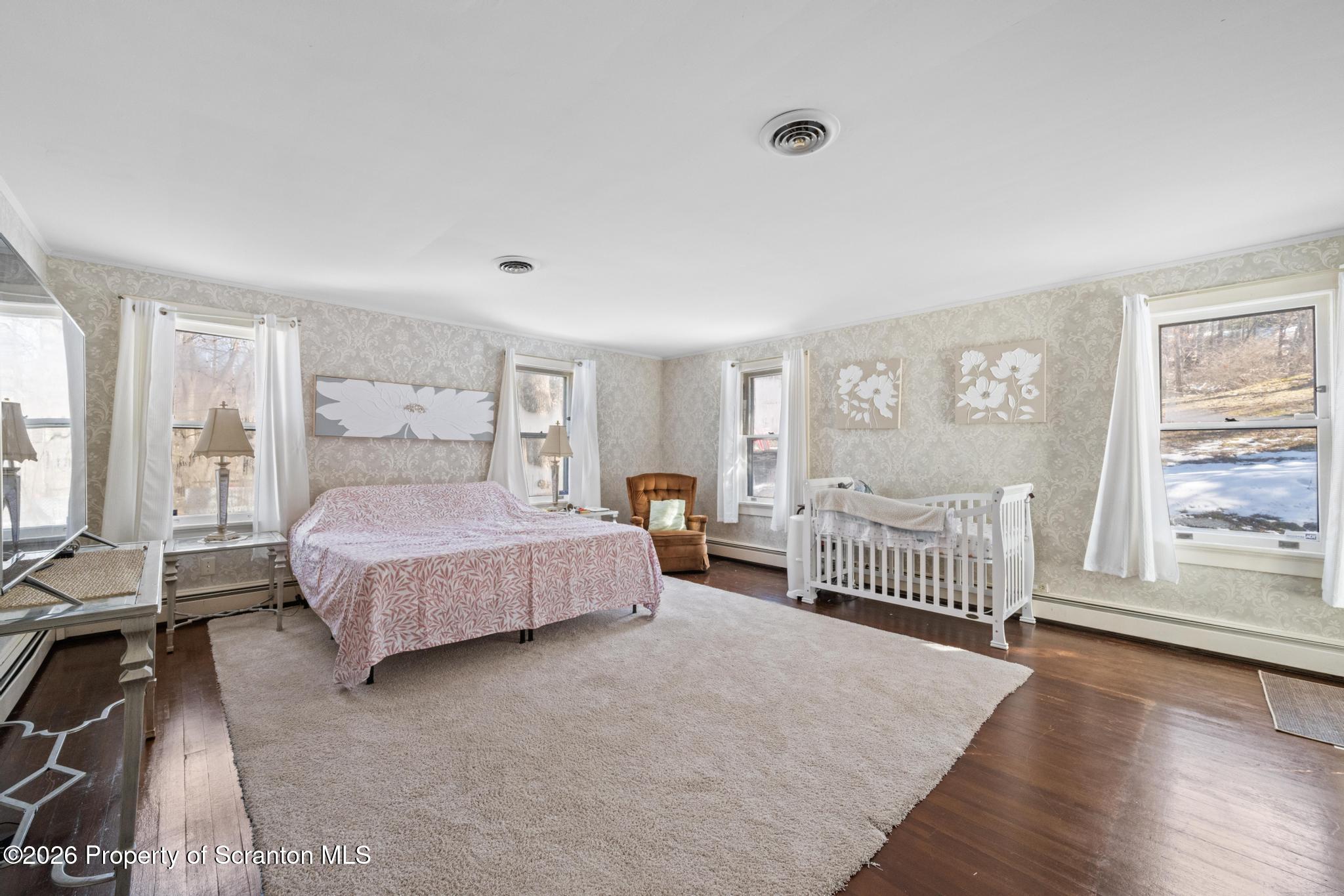 502 Gravel Pond Road Clarks Summit, PA 18411 - Photo 73 of 91 a bedroom with a bed and a large window