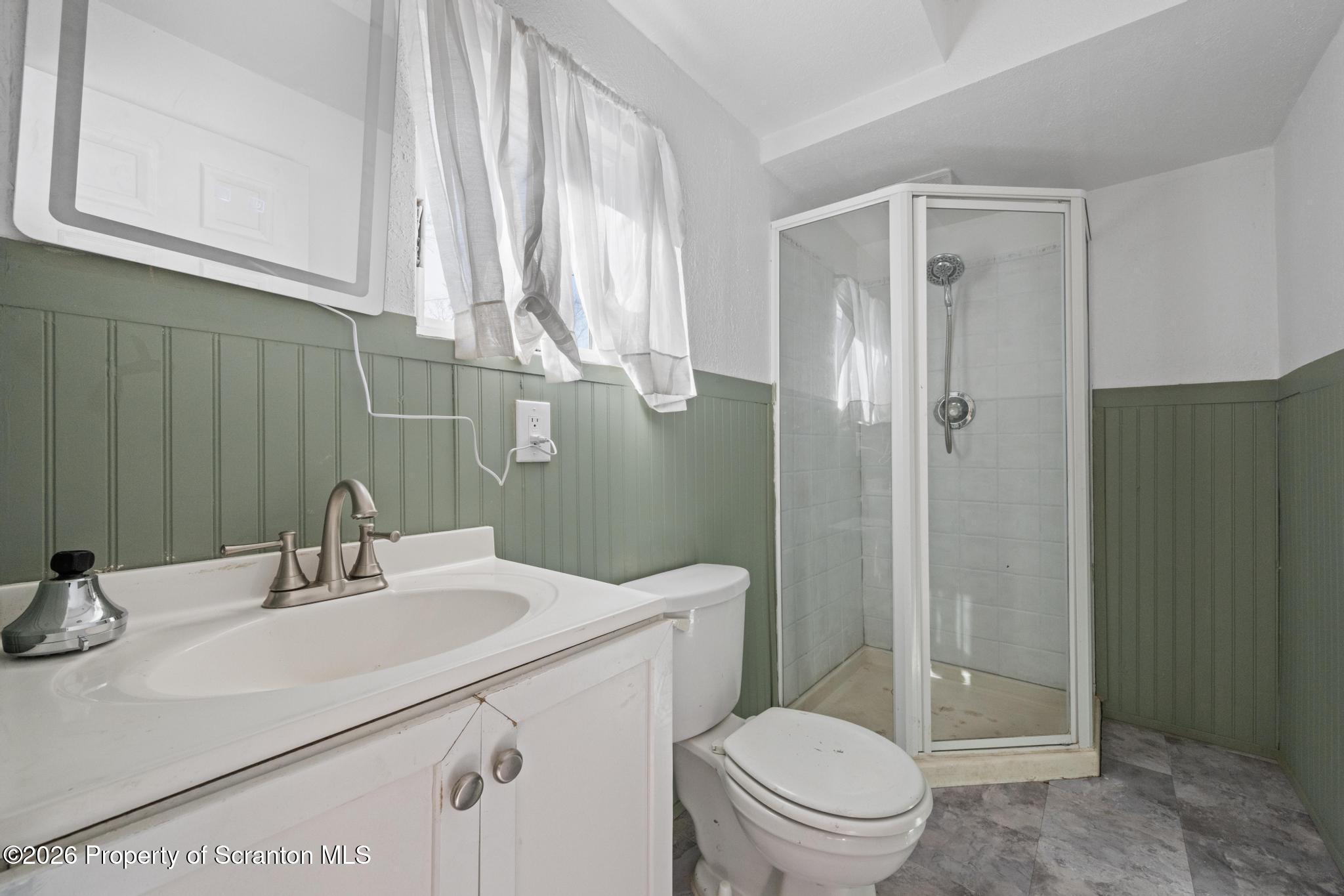 502 Gravel Pond Road Clarks Summit, PA 18411 - Photo 85 of 91 a bathroom with a sink a toilet and shower