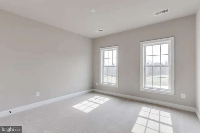 a view of a kitchen with a sink and a large window