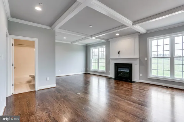 a view of a grassy field with trees