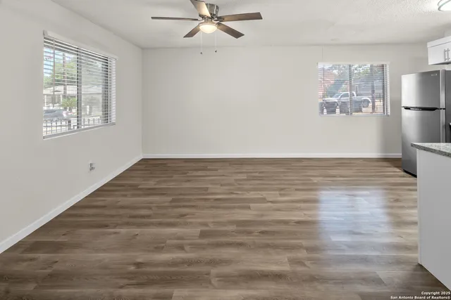 a view of an empty room with a window
