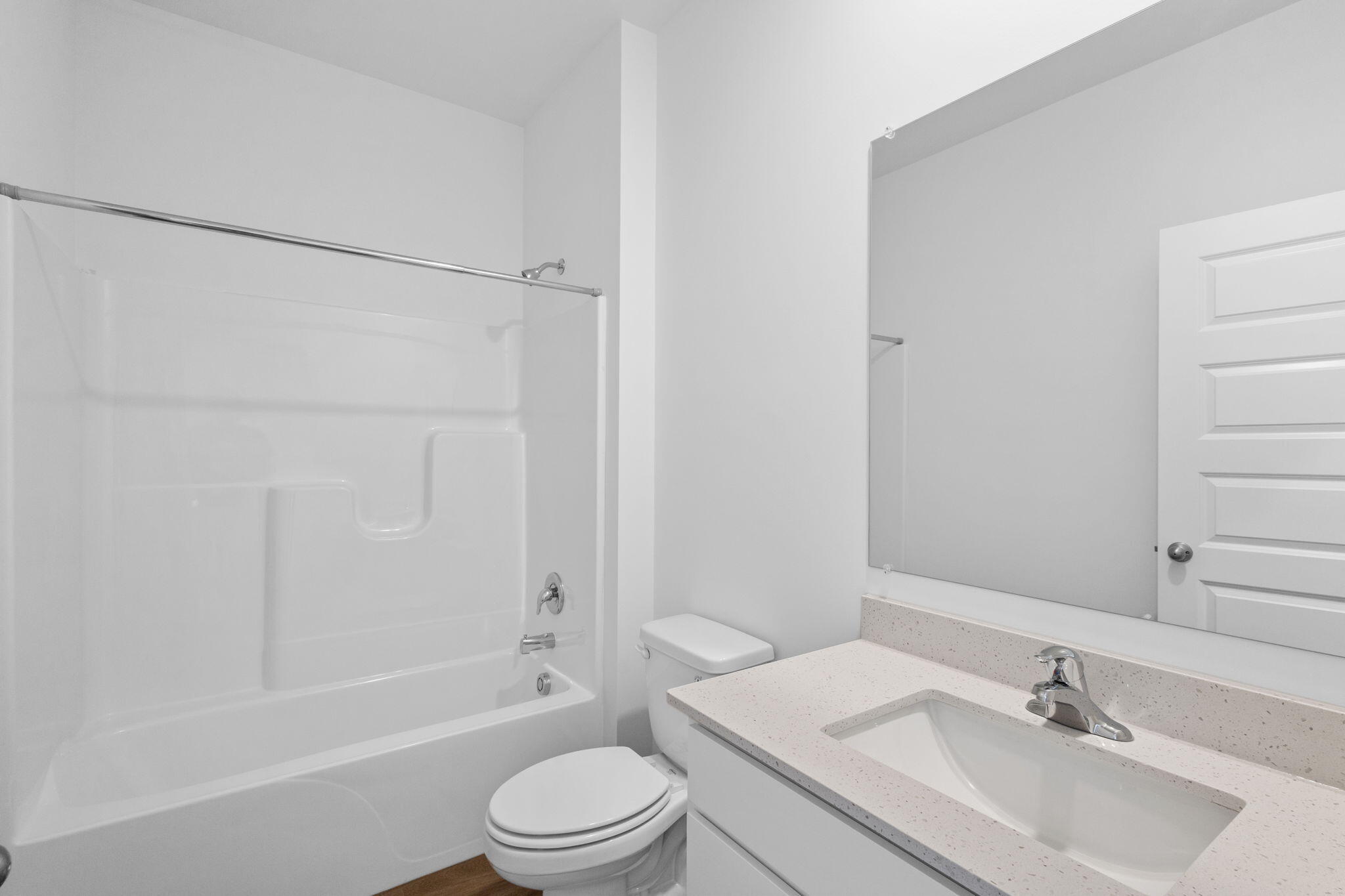 10596 Morse Place Crown Point, IN 46307 - Photo 11 of 16 a bathroom with a bathtub shower sink vanity mirror and toilet