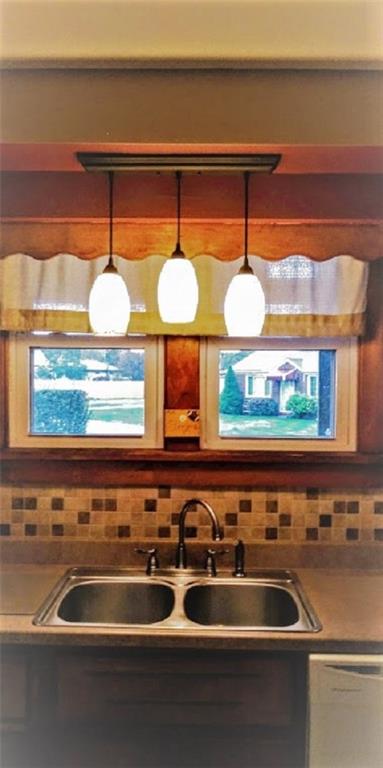 1228 Washington Street Rochester, PA 15074 - Photo 4 of 24 Close up of gorgeous back splash, new sink and amazing light fixture.
