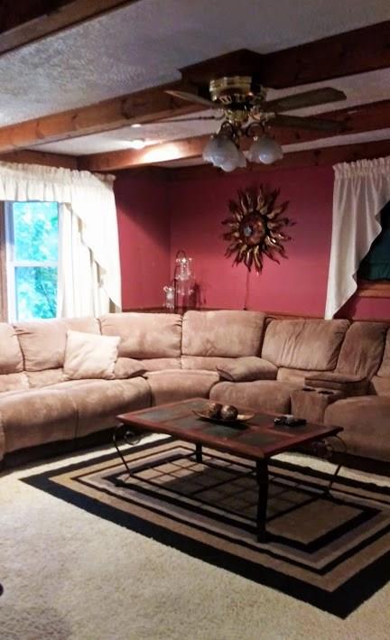 1228 Washington Street Rochester, PA 15074 - Photo 8 of 24 Cozy and inviting living room with wooden ceiling beams and new carpet.