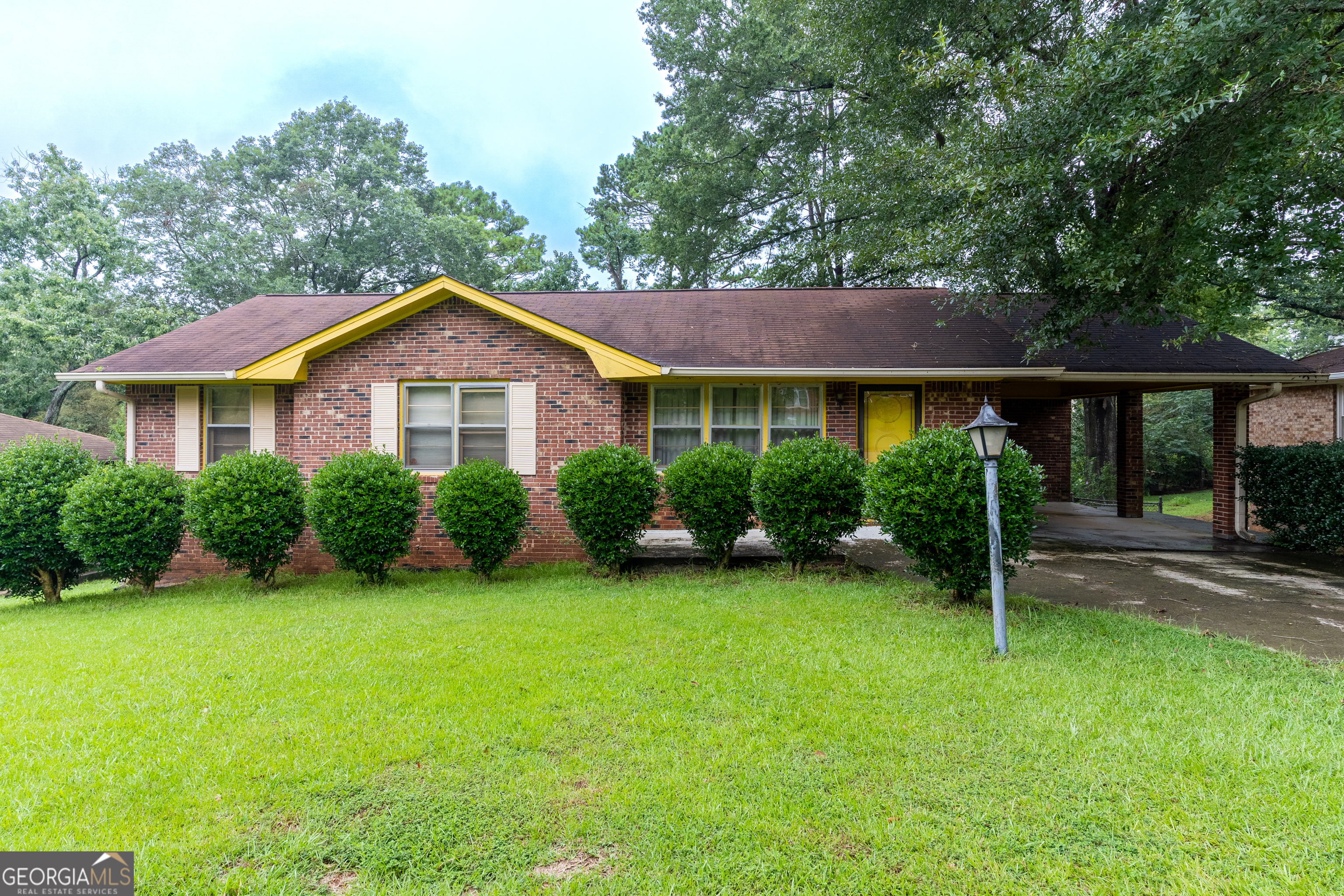 6485 Carolyn Court Rex, GA 30273 - Photo 1 of 1 a front view of a house with a yard and green space