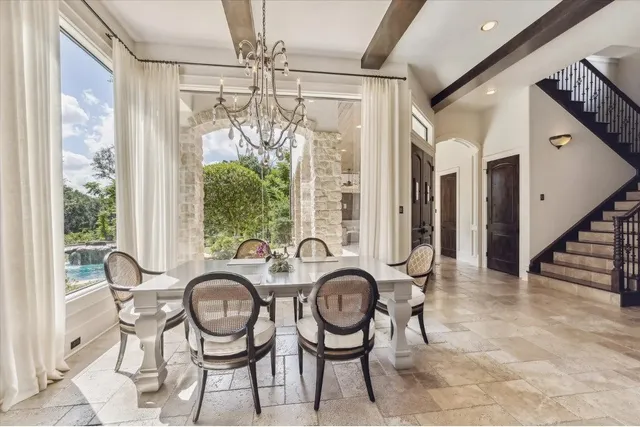 a view of a dining room with furniture window and outside view