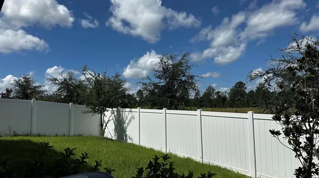 a backyard of a house with lots of green space