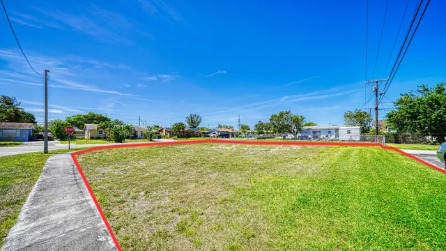 a view of a swimming pool with outdoor seating