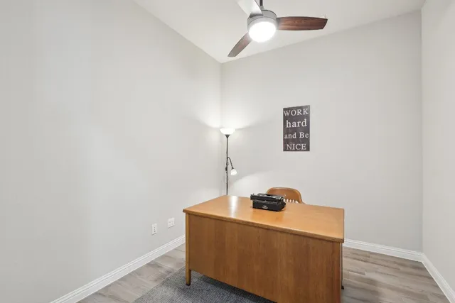 a room with a table and a lamp