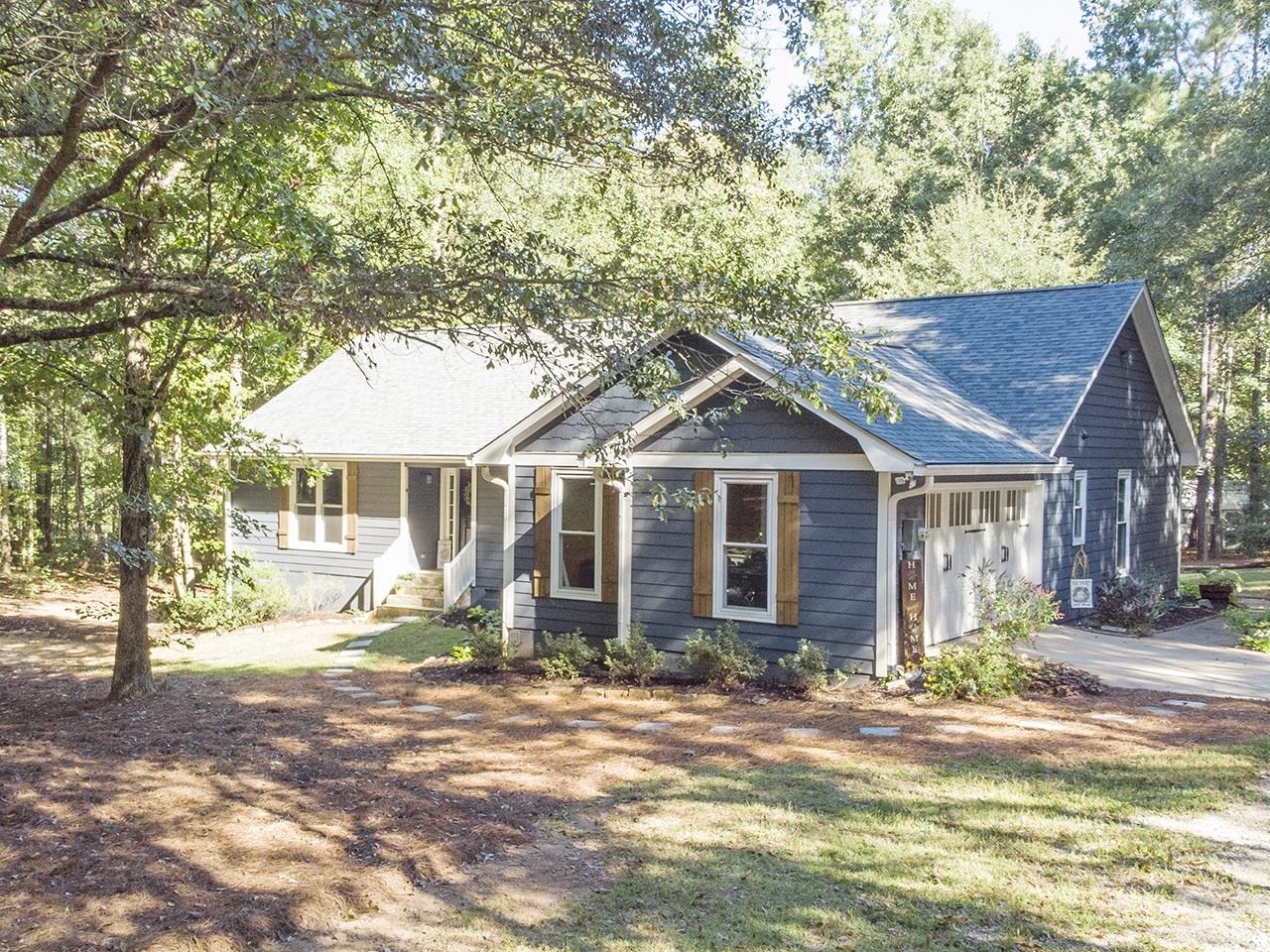 615 Frog Road Locust Grove, GA 30248 - Photo 1 of 1 a front view of a house with a yard