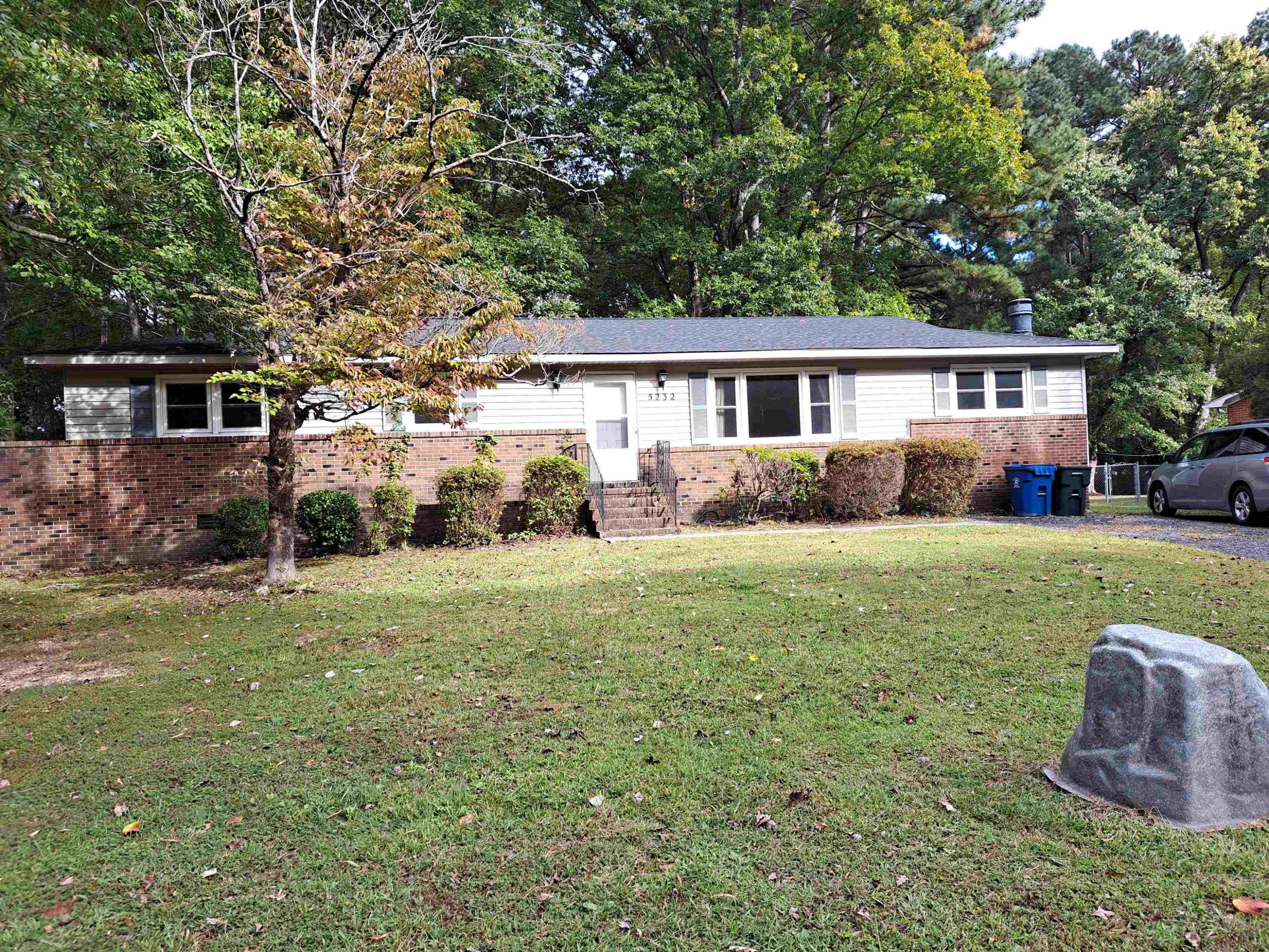 5232 Guess Road Durham, NC 27712 - Photo 2 of 17 a view of a house with a yard and plants