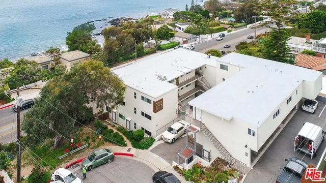 an aerial view of residential house with outdoor space and street view
