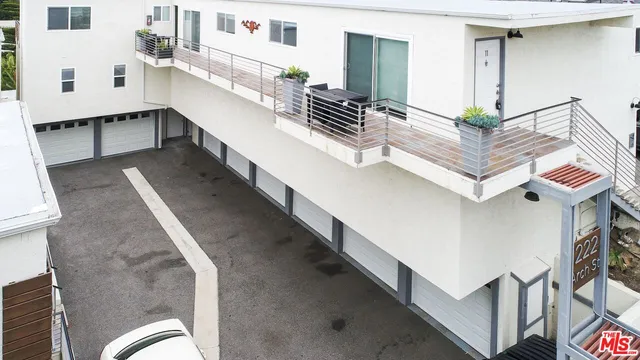 a living room with furniture and stairs