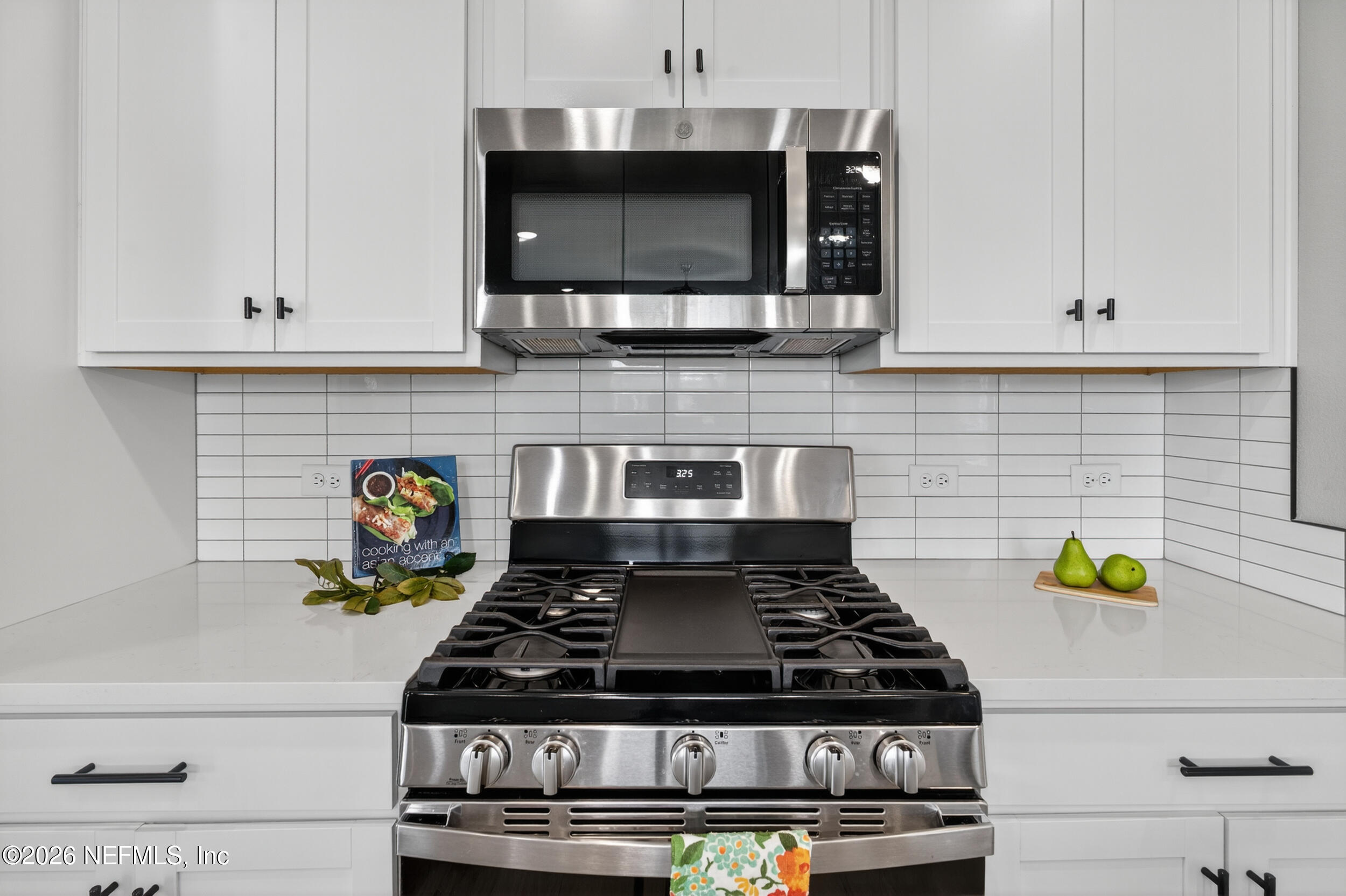 57 Cedar Elm Way St. Augustine, FL 32092 - Photo 13 of 65 a stove top oven sitting inside of a kitchen