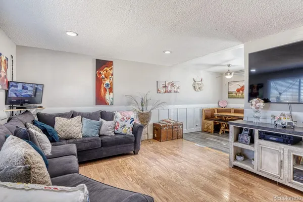a room with furniture and wooden floor