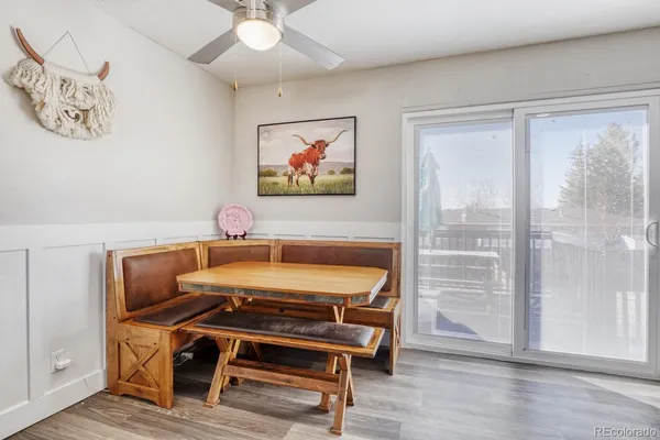 a kitchen with granite countertop stainless steel appliances a refrigerator sink and microwave