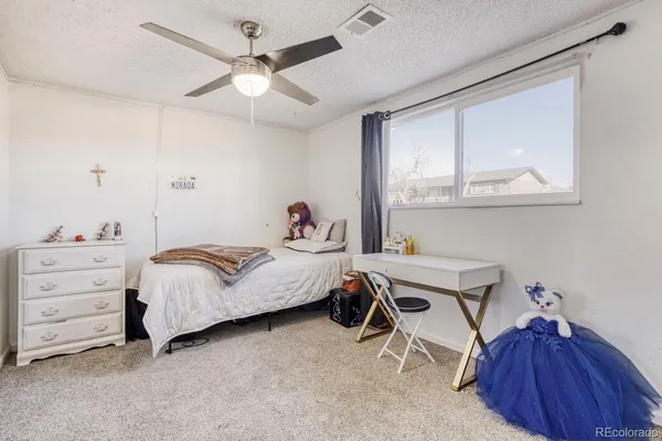 a bedroom with furniture and a window