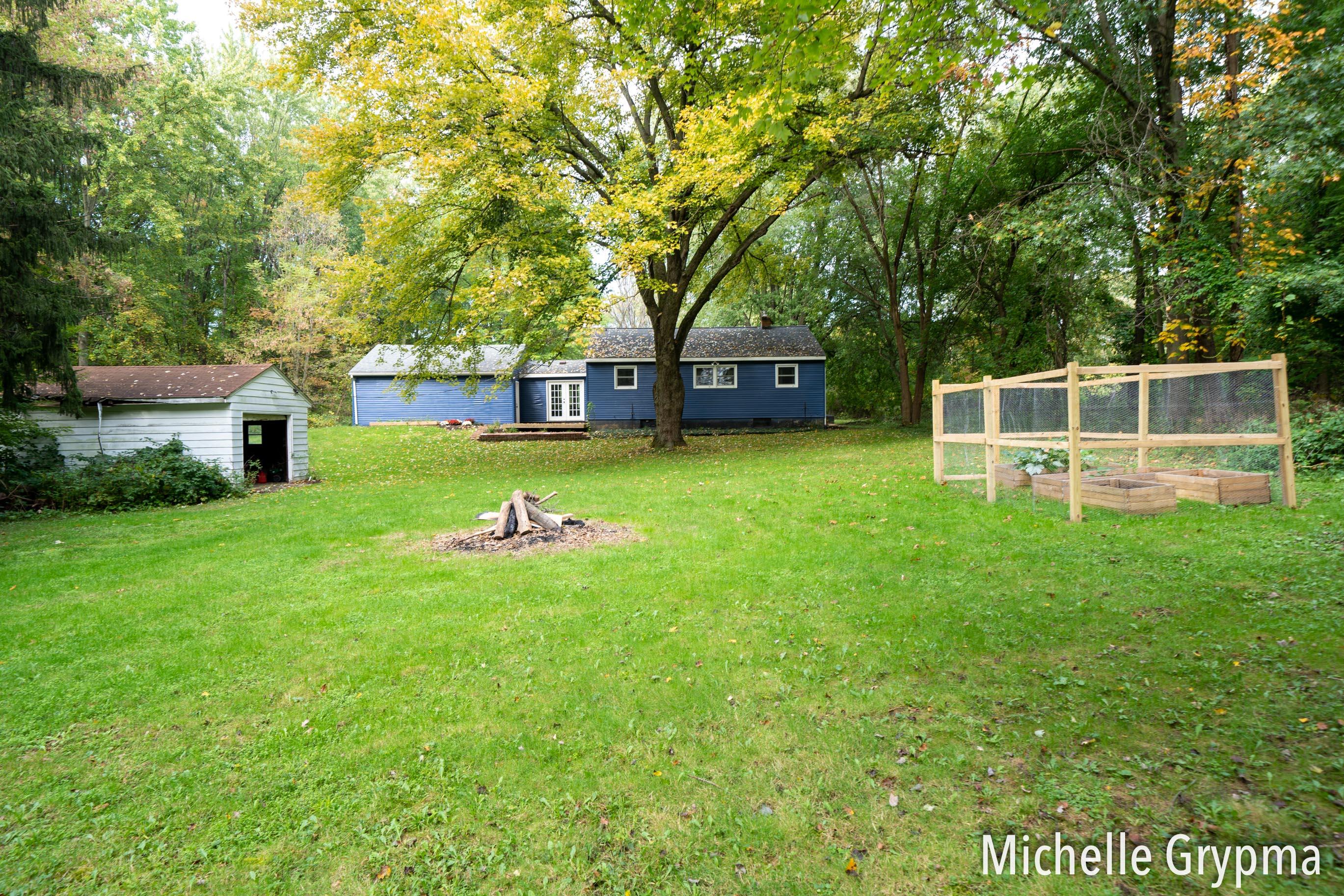 6084 Cascade Road Southeast Grand Rapids, MI 49546 - Photo 37 of 46 Garden/fire pit