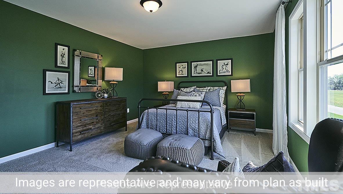 7704 Calcutta Drive Willow Spring, NC 27592 - Photo 19 of 30 a living room with furniture and a wooden floor