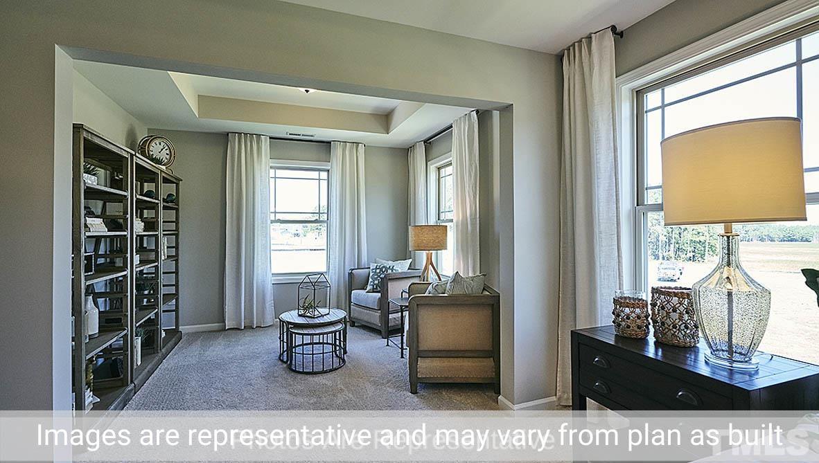 7704 Calcutta Drive Willow Spring, NC 27592 - Photo 25 of 30 a living room with furniture